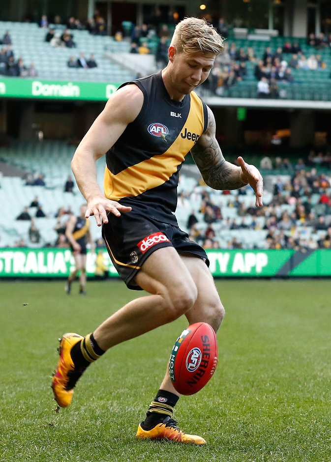 AFL 2016 Rd 14 - Richmond v Brisbane MELBOURNE, AUSTRALIA - JUNE 25: Debutante, Nathan Broad of the Tigers kicks the ball during the 2016 AFL Round 14 match between the Richmond Tigers and the Brisbane Lions at the Melbourne Cricket Ground on June 25, 2016 in Melbourne, Australia. (Photo by Adam Trafford/AFL Media)